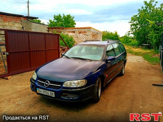 Синий Опель Омега, объемом двигателя 2 л и пробегом 300 тыс. км за 1100 $, фото 1 на Automoto.ua
