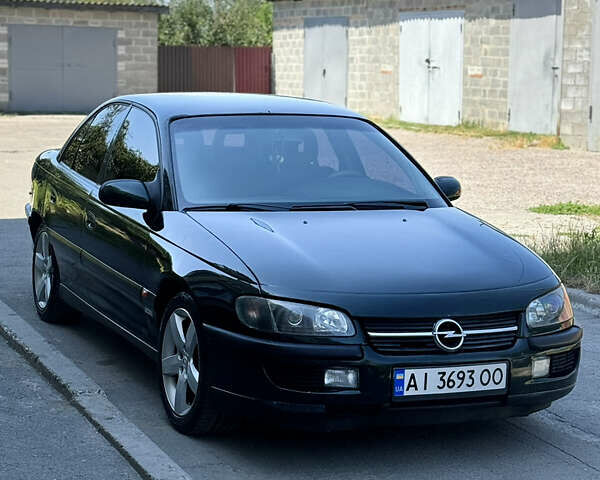 Зеленый Опель Омега, объемом двигателя 2 л и пробегом 305 тыс. км за 2200 $, фото 1 на Automoto.ua