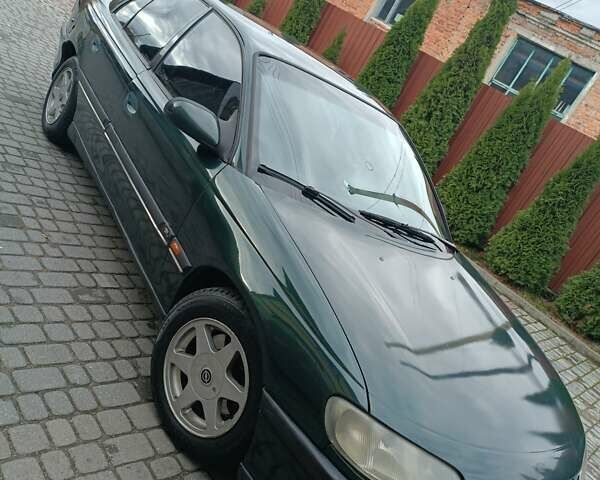 Зеленый Опель Омега, объемом двигателя 2.5 л и пробегом 400 тыс. км за 2150 $, фото 1 на Automoto.ua