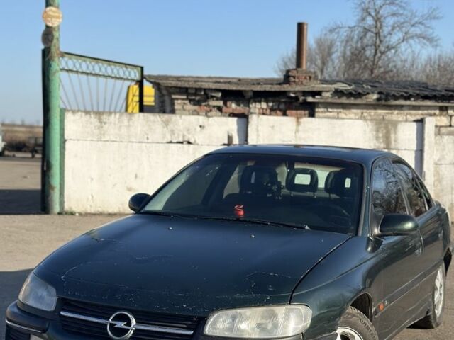 Зеленый Опель Омега, объемом двигателя 2 л и пробегом 100 тыс. км за 1300 $, фото 1 на Automoto.ua