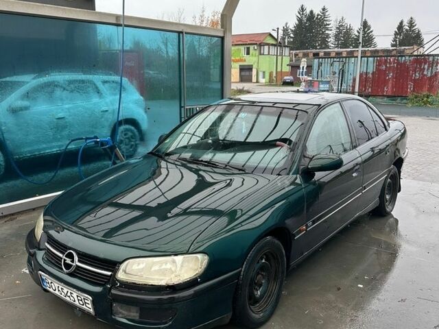 Зеленый Опель Омега, объемом двигателя 2 л и пробегом 300 тыс. км за 1250 $, фото 1 на Automoto.ua