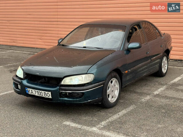 Зеленый Опель Омега, объемом двигателя 2 л и пробегом 250 тыс. км за 1250 $, фото 1 на Automoto.ua