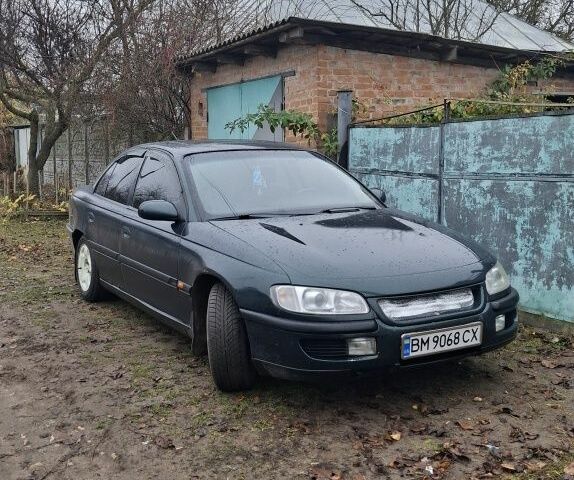Зеленый Опель Омега, объемом двигателя 3 л и пробегом 350 тыс. км за 2031 $, фото 1 на Automoto.ua