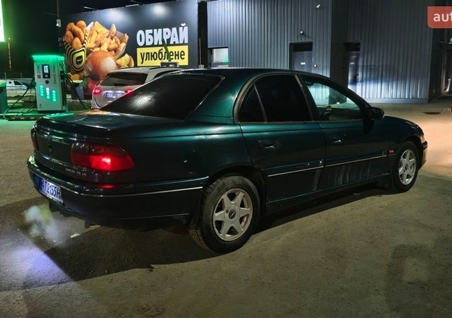 Зеленый Опель Омега, объемом двигателя 2.5 л и пробегом 390 тыс. км за 2300 $, фото 1 на Automoto.ua