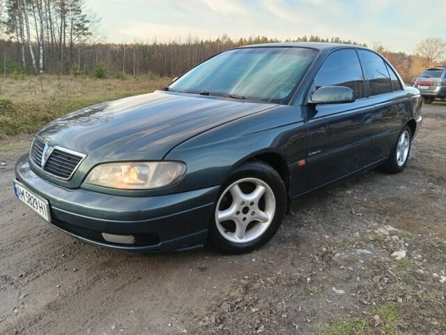 Зеленый Опель Омега, объемом двигателя 2.5 л и пробегом 344 тыс. км за 2250 $, фото 1 на Automoto.ua