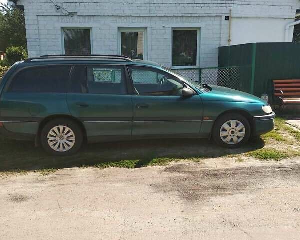 Зеленый Опель Омега, объемом двигателя 2 л и пробегом 350 тыс. км за 1750 $, фото 1 на Automoto.ua