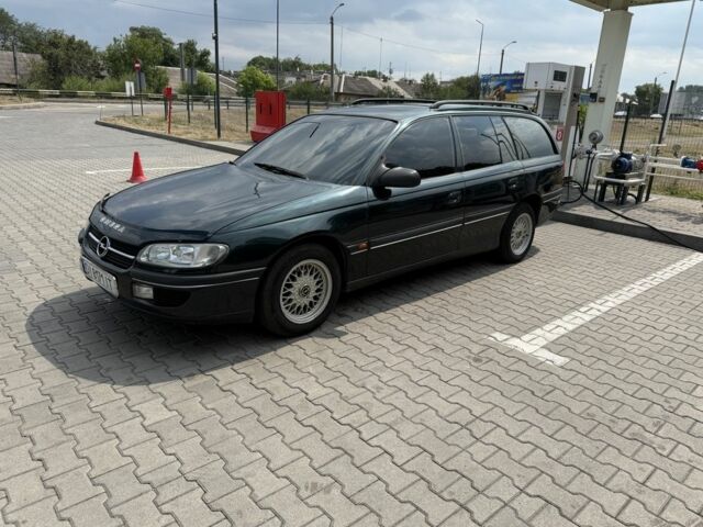 Зеленый Опель Омега, объемом двигателя 2 л и пробегом 230 тыс. км за 3000 $, фото 1 на Automoto.ua