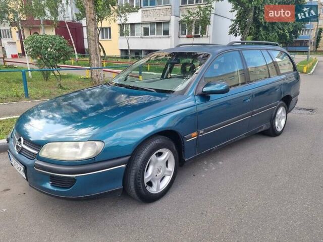 Зеленый Опель Омега, объемом двигателя 2 л и пробегом 294 тыс. км за 2100 $, фото 1 на Automoto.ua
