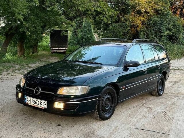 Зелений Опель Омега, об'ємом двигуна 2 л та пробігом 300 тис. км за 1350 $, фото 1 на Automoto.ua