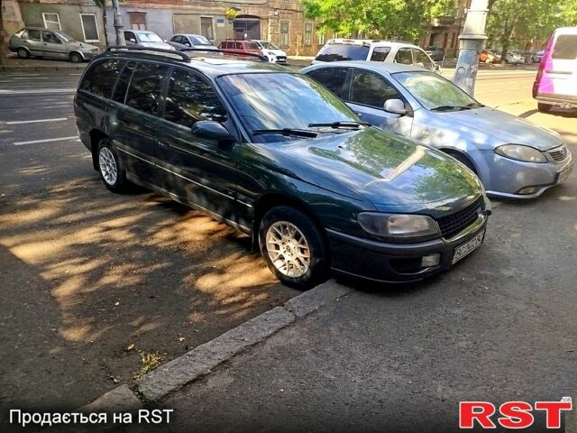 Зеленый Опель Омега, объемом двигателя 2.5 л и пробегом 381 тыс. км за 2000 $, фото 1 на Automoto.ua