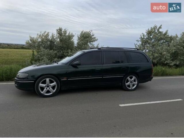 Зелений Опель Омега, об'ємом двигуна 2 л та пробігом 380 тис. км за 2210 $, фото 1 на Automoto.ua