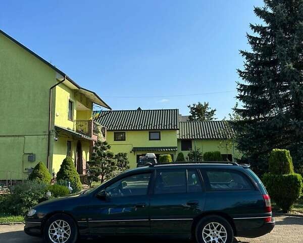 Зеленый Опель Омега, объемом двигателя 2 л и пробегом 240 тыс. км за 2900 $, фото 1 на Automoto.ua