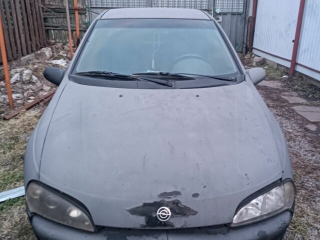 Черный Опель Тигра, объемом двигателя 2 л и пробегом 177 тыс. км за 799 $, фото 1 на Automoto.ua