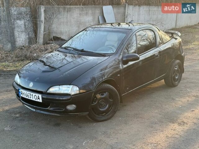 Черный Опель Тигра, объемом двигателя 1.39 л и пробегом 555 тыс. км за 1375 $, фото 1 на Automoto.ua