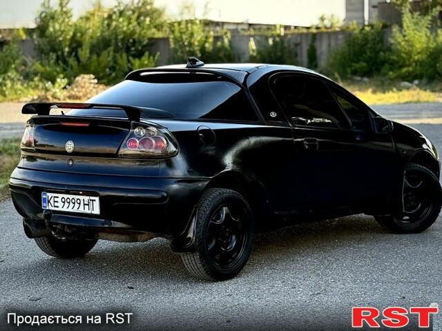 Опель Тигра, объемом двигателя 1.4 л и пробегом 222 тыс. км за 1650 $, фото 1 на Automoto.ua
