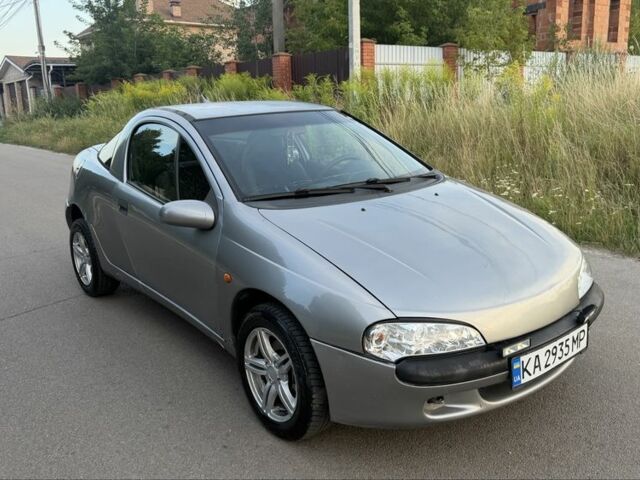 Серый Опель Тигра, объемом двигателя 1.4 л и пробегом 200 тыс. км за 2306 $, фото 1 на Automoto.ua