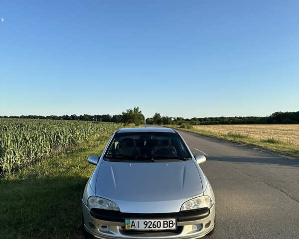 Сірий Опель Тігра, об'ємом двигуна 1.39 л та пробігом 288 тис. км за 3000 $, фото 1 на Automoto.ua