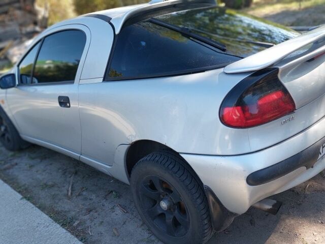 Серый Опель Тигра, объемом двигателя 1.6 л и пробегом 158 тыс. км за 2600 $, фото 1 на Automoto.ua