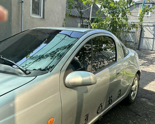 Серый Опель Тигра, объемом двигателя 1.4 л и пробегом 188 тыс. км за 2800 $, фото 1 на Automoto.ua