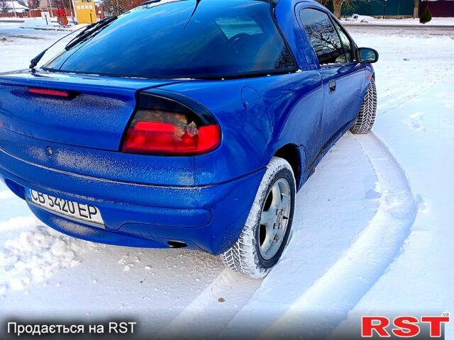 Синий Опель Тигра, объемом двигателя 1.6 л и пробегом 350 тыс. км за 1600 $, фото 1 на Automoto.ua