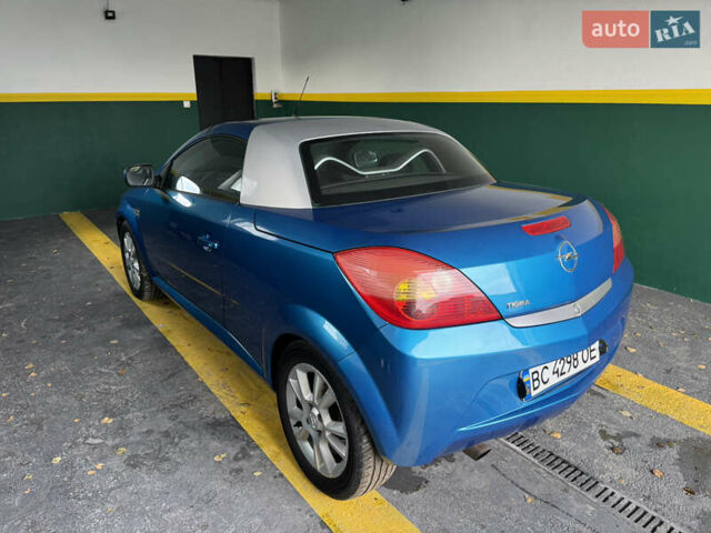 Синий Опель Тигра, объемом двигателя 1.39 л и пробегом 200 тыс. км за 4300 $, фото 1 на Automoto.ua