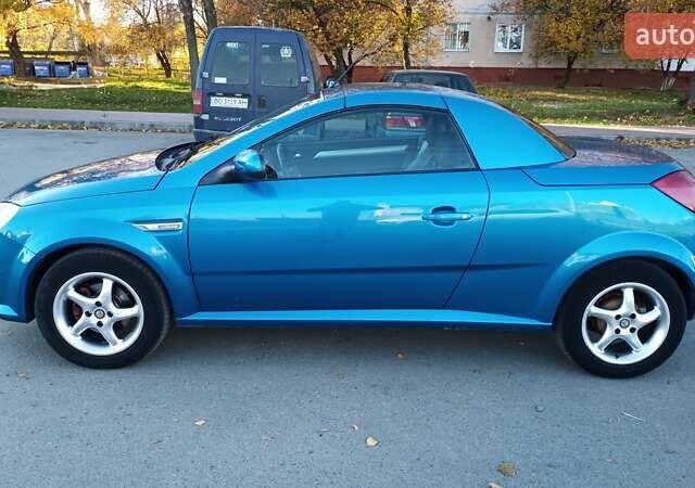 Синий Опель Тигра, объемом двигателя 1.3 л и пробегом 215 тыс. км за 5700 $, фото 1 на Automoto.ua