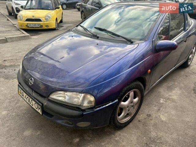 Синий Опель Тигра, объемом двигателя 1.6 л и пробегом 270 тыс. км за 1999 $, фото 1 на Automoto.ua