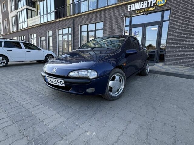 Синий Опель Тигра, объемом двигателя 1.6 л и пробегом 249 тыс. км за 2099 $, фото 1 на Automoto.ua