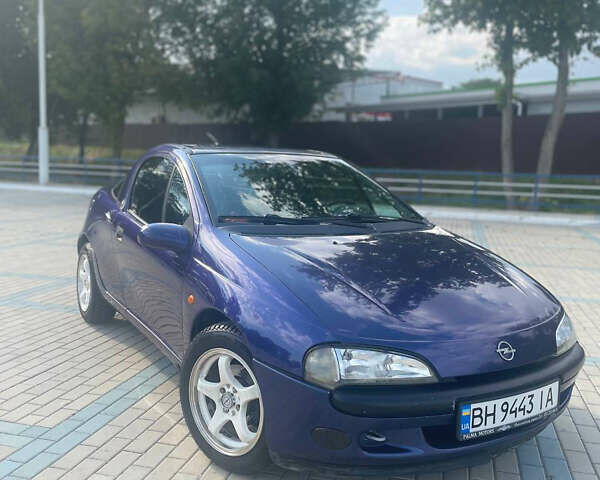 Синий Опель Тигра, объемом двигателя 1.4 л и пробегом 242 тыс. км за 3300 $, фото 1 на Automoto.ua