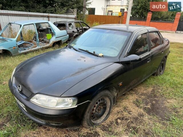 Черный Опель Вектра, объемом двигателя 1.6 л и пробегом 300 тыс. км за 600 $, фото 1 на Automoto.ua
