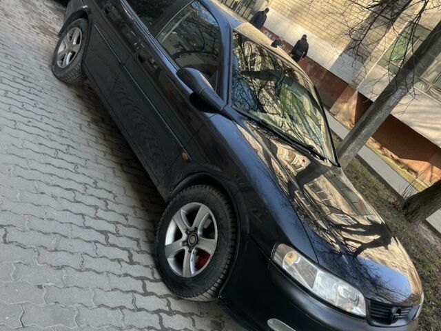 Черный Опель Вектра, объемом двигателя 2 л и пробегом 297 тыс. км за 2350 $, фото 1 на Automoto.ua