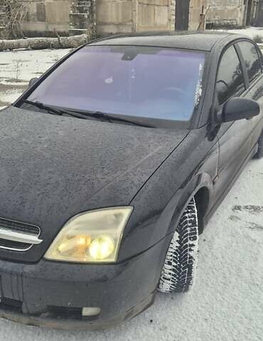 Чорний Опель Вектра, об'ємом двигуна 2 л та пробігом 369 тис. км за 1999 $, фото 1 на Automoto.ua