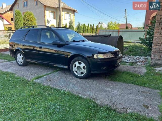 Чорний Опель Вектра, об'ємом двигуна 2 л та пробігом 300 тис. км за 1999 $, фото 1 на Automoto.ua