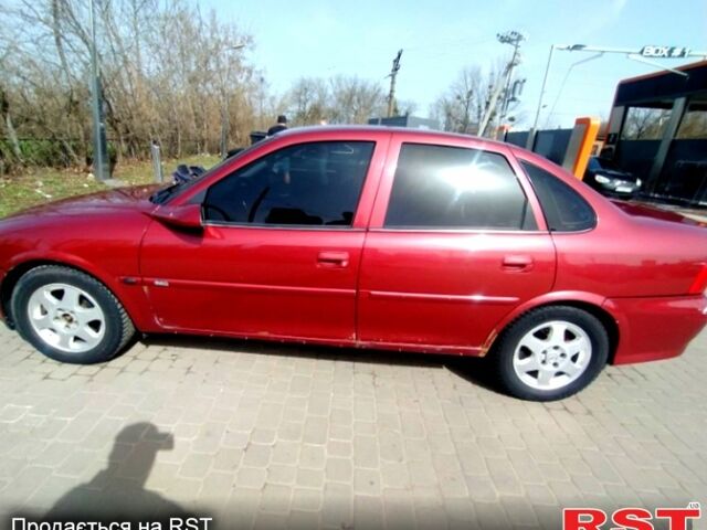 Красный Опель Вектра, объемом двигателя 1.8 л и пробегом 293 тыс. км за 2400 $, фото 1 на Automoto.ua