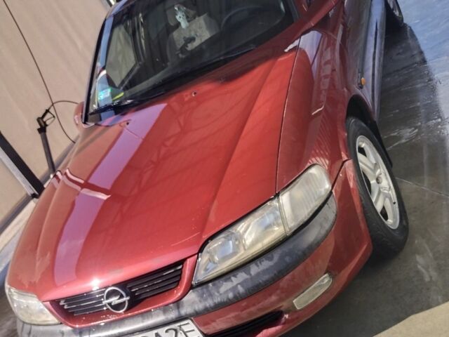 Червоний Опель Вектра, об'ємом двигуна 2 л та пробігом 323 тис. км за 1400 $, фото 1 на Automoto.ua