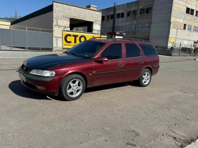 Красный Опель Вектра, объемом двигателя 2 л и пробегом 200 тыс. км за 1600 $, фото 1 на Automoto.ua