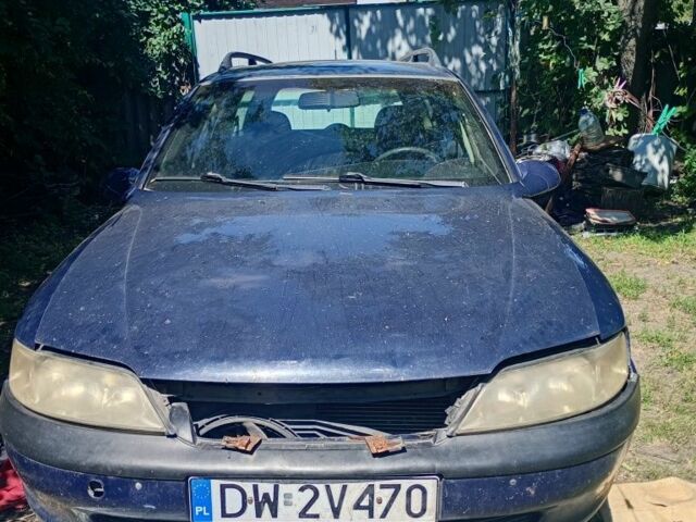 Синій Опель Вектра, об'ємом двигуна 1 л та пробігом 300 тис. км за 607 $, фото 1 на Automoto.ua