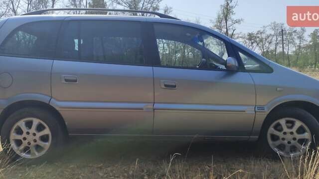 Синий Опель Зафира, объемом двигателя 2 л и пробегом 406 тыс. км за 4000 $, фото 1 на Automoto.ua