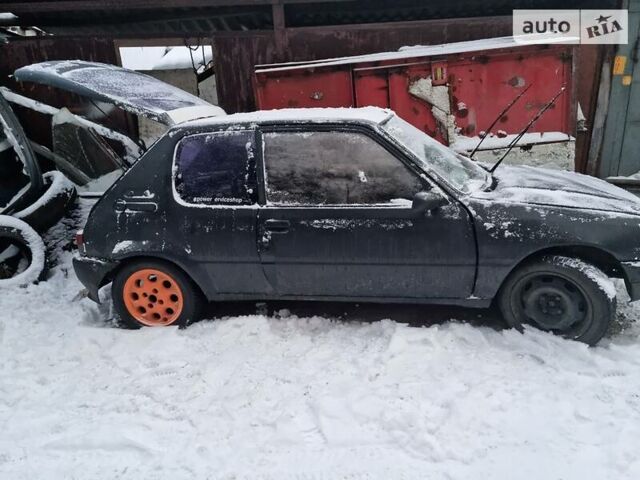 Чорний Пежо 205, об'ємом двигуна 1.4 л та пробігом 100 тис. км за 1000 $, фото 1 на Automoto.ua