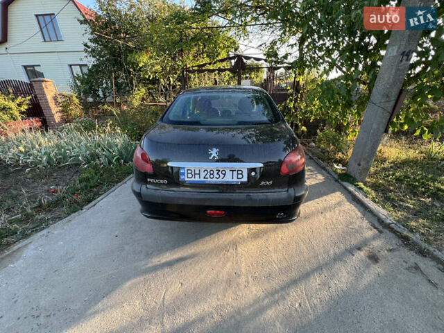 Черный Пежо 206, объемом двигателя 1.36 л и пробегом 161 тыс. км за 2500 $, фото 1 на Automoto.ua