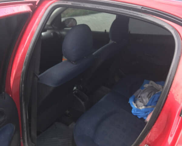 Красный Пежо 206, объемом двигателя 1.4 л и пробегом 270 тыс. км за 3350 $, фото 1 на Automoto.ua