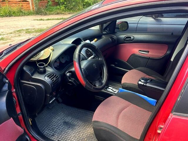 Червоний Пежо 206, об'ємом двигуна 1.4 л та пробігом 0 тис. км за 2950 $, фото 1 на Automoto.ua