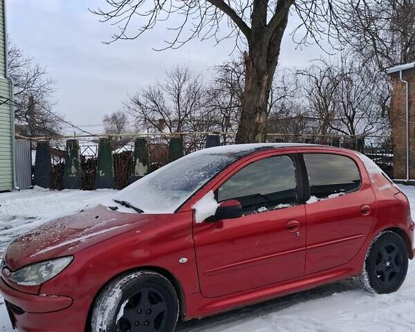 Красный Пежо 206, объемом двигателя 1.4 л и пробегом 296 тыс. км за 3000 $, фото 1 на Automoto.ua