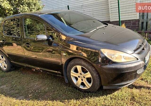 Черный Пежо 307, объемом двигателя 2 л и пробегом 205 тыс. км за 3900 $, фото 1 на Automoto.ua