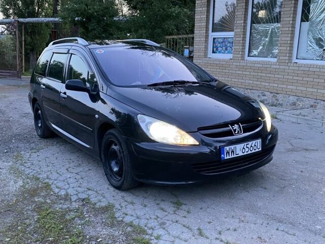 Черный Пежо 307, объемом двигателя 2 л и пробегом 334 тыс. км за 1950 $, фото 1 на Automoto.ua