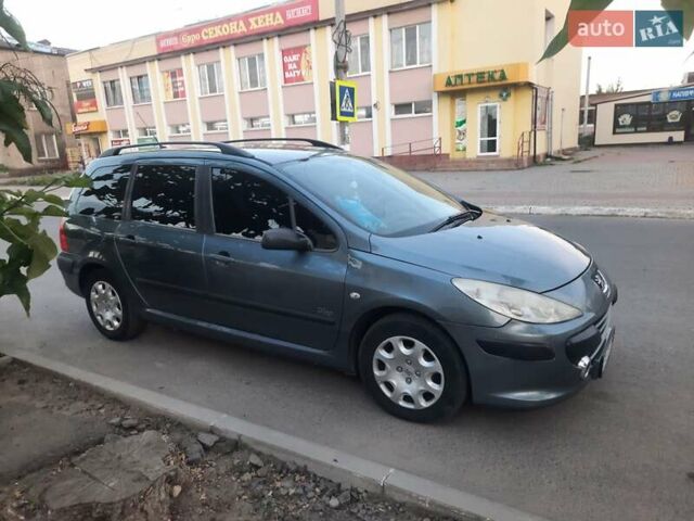 Серый Пежо 307, объемом двигателя 1.4 л и пробегом 200 тыс. км за 4000 $, фото 1 на Automoto.ua