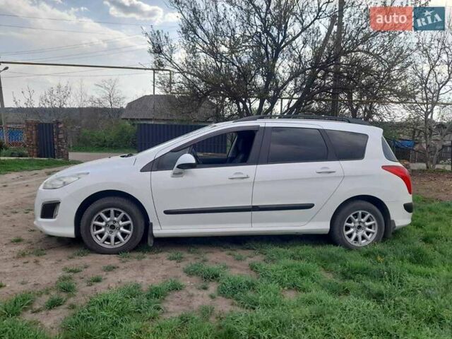 Белый Пежо 308, объемом двигателя 1.6 л и пробегом 260 тыс. км за 5200 $, фото 1 на Automoto.ua