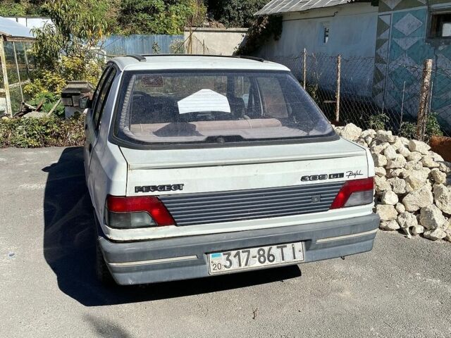Белый Пежо 309, объемом двигателя 1.4 л и пробегом 169 тыс. км за 500 $, фото 1 на Automoto.ua