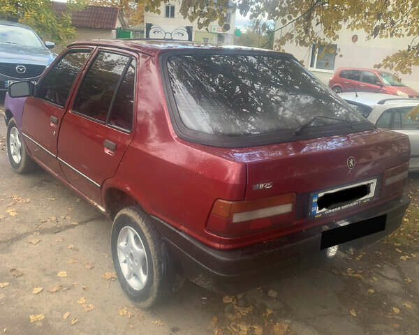 Красный Пежо 309, объемом двигателя 1.6 л и пробегом 100 тыс. км за 950 $, фото 1 на Automoto.ua