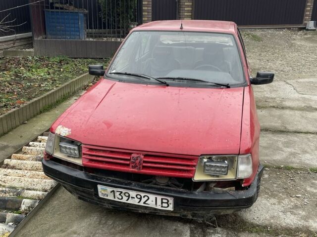 Красный Пежо 309, объемом двигателя 1.4 л и пробегом 250 тыс. км за 600 $, фото 1 на Automoto.ua
